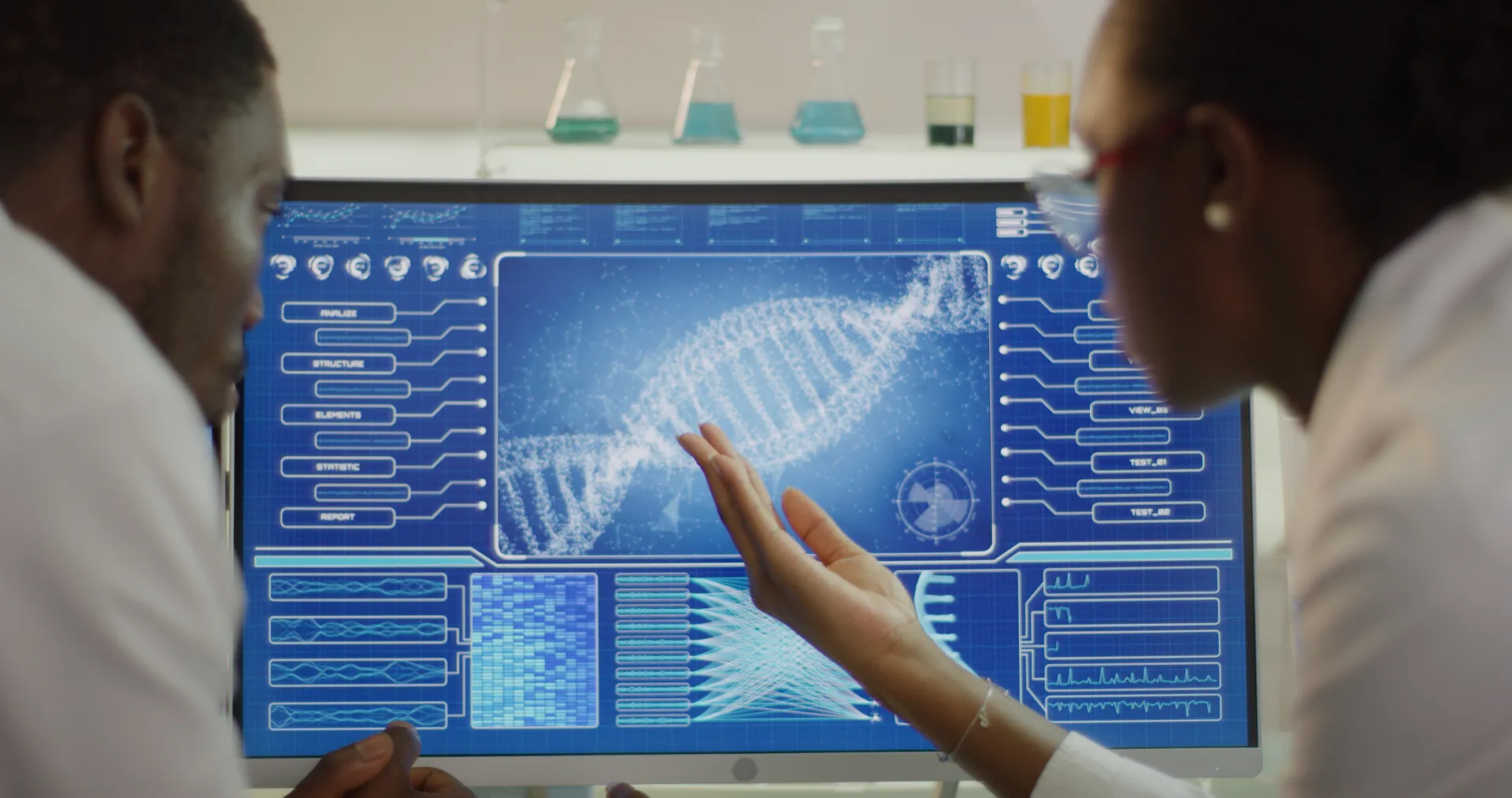 Scientist reviewing DNA sequence data on a screen in a genetics research laboratory