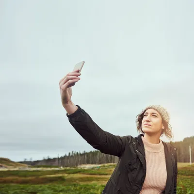 Woman taking a selfie while hiking