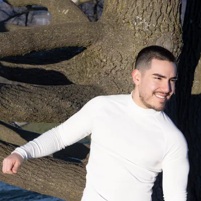 Young man smiling in a park