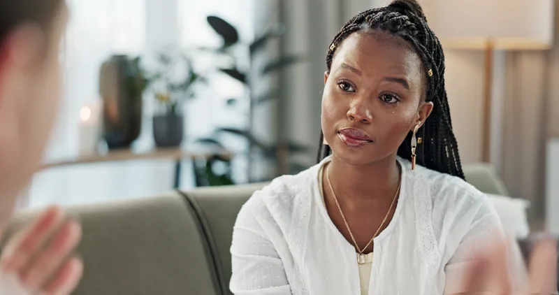 A therapist talking with a patient in her office